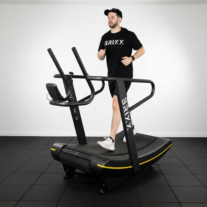 Person using a treadmill with 'BRIXX' branding in a studio setting